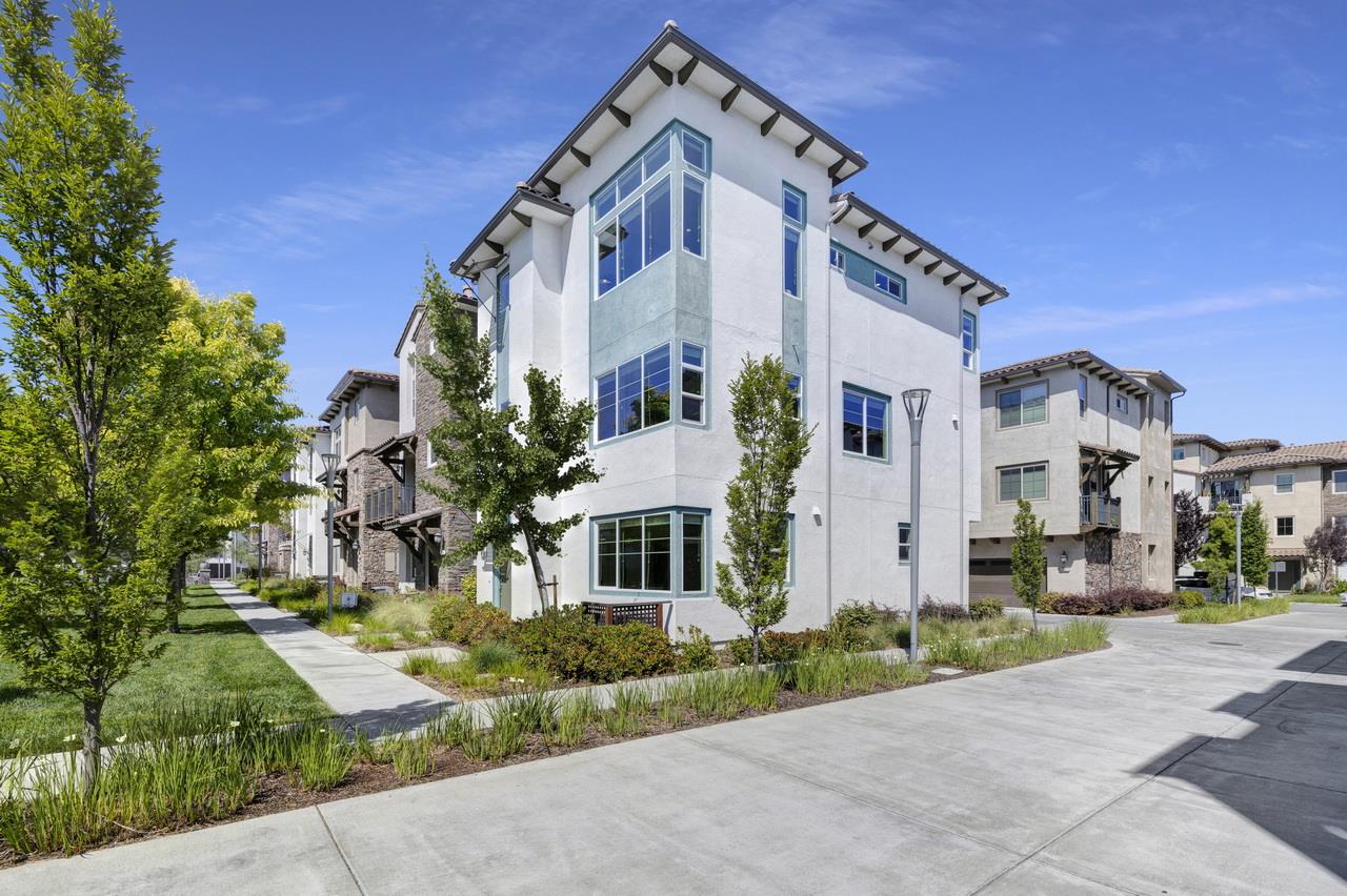 a front view of a residential houses with yard