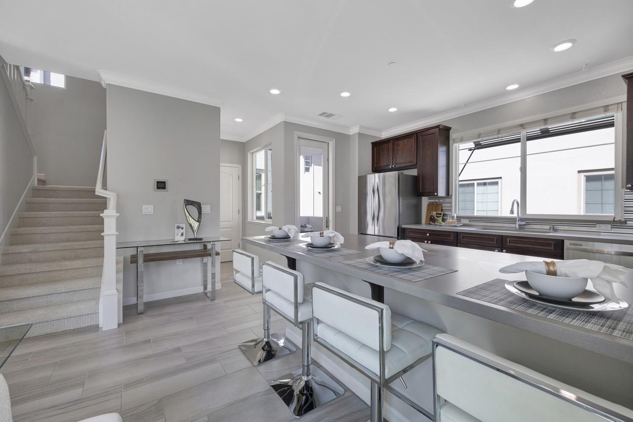 3079 Manuel Loop San Jose, CA 95136 - Photo 16 of 64 a kitchen with counter space dining table and chairs