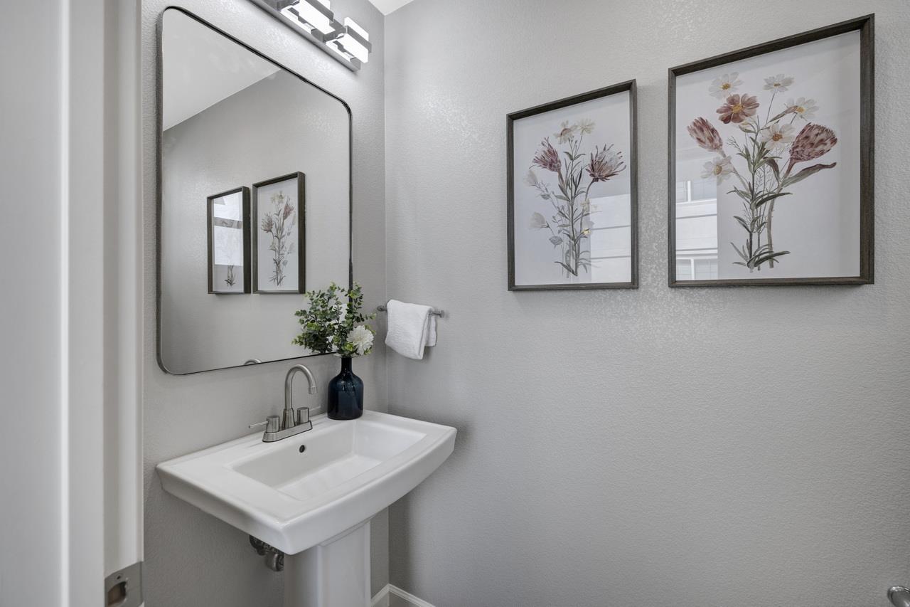 3079 Manuel Loop San Jose, CA 95136 - Photo 22 of 64 a bathroom with a sink and a mirror