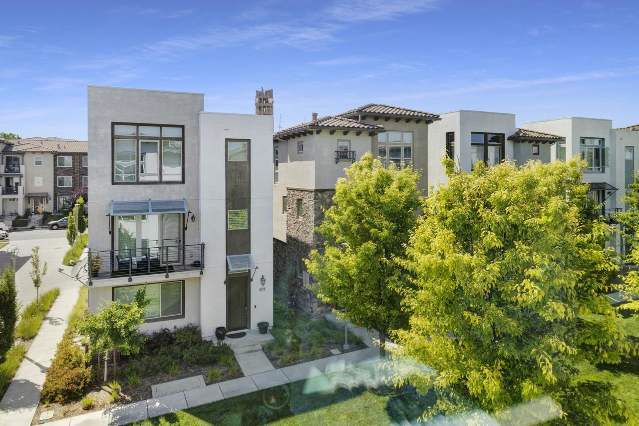 3079 Manuel Loop San Jose, CA 95136 - Photo 30 of 64 a front view of a multi story residential apartment building with a yard