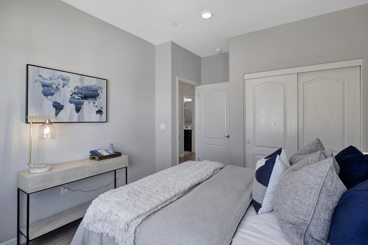 3079 Manuel Loop San Jose, CA 95136 - Photo 35 of 64 a bedroom with a bed and a lamp on dresser