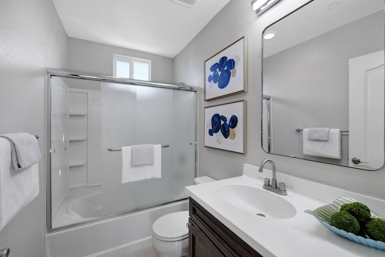 3079 Manuel Loop San Jose, CA 95136 - Photo 40 of 64 a bathroom with a sink and a mirror
