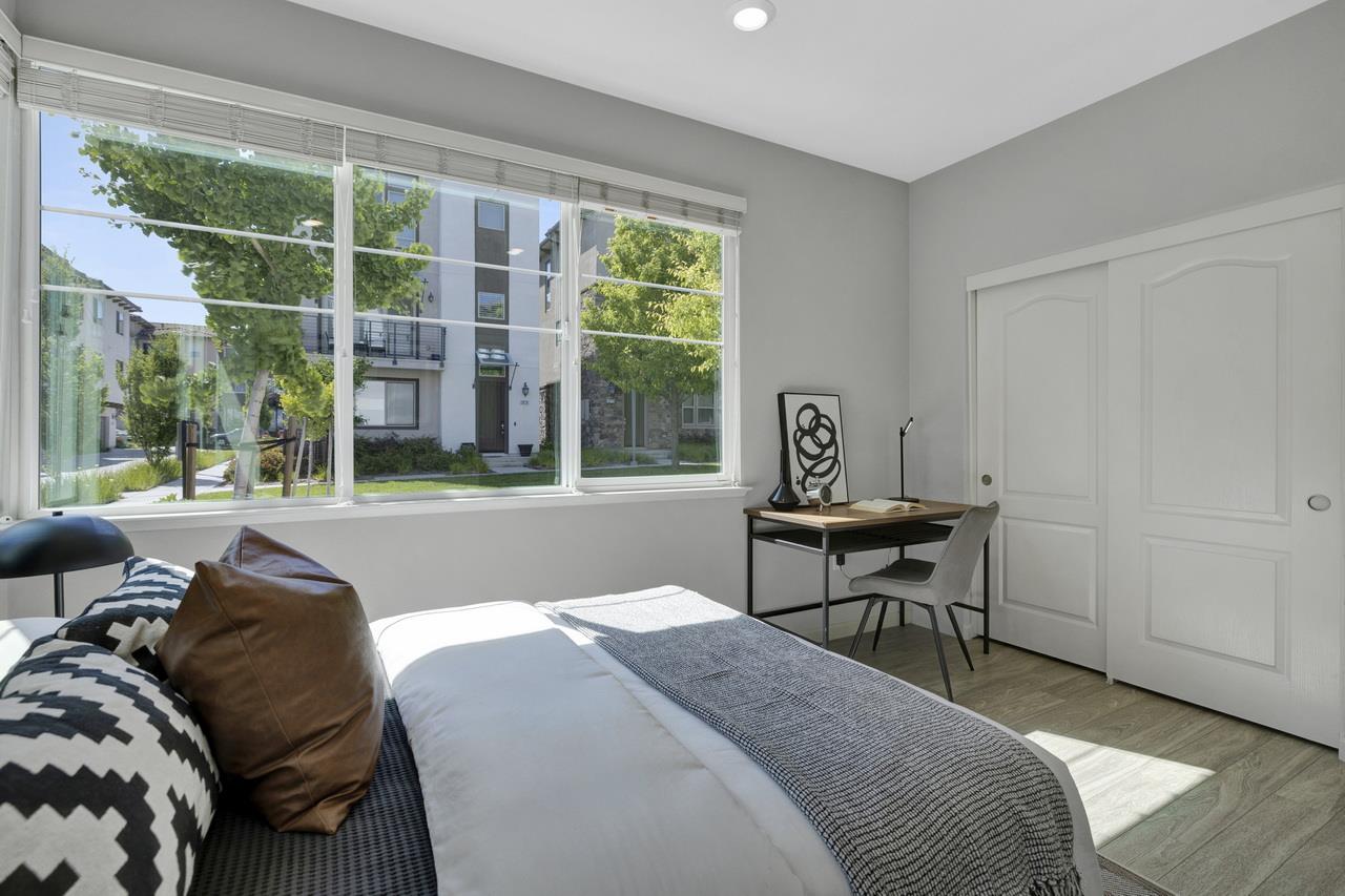 3079 Manuel Loop San Jose, CA 95136 - Photo 42 of 64 a bedroom with a bed table and two large window