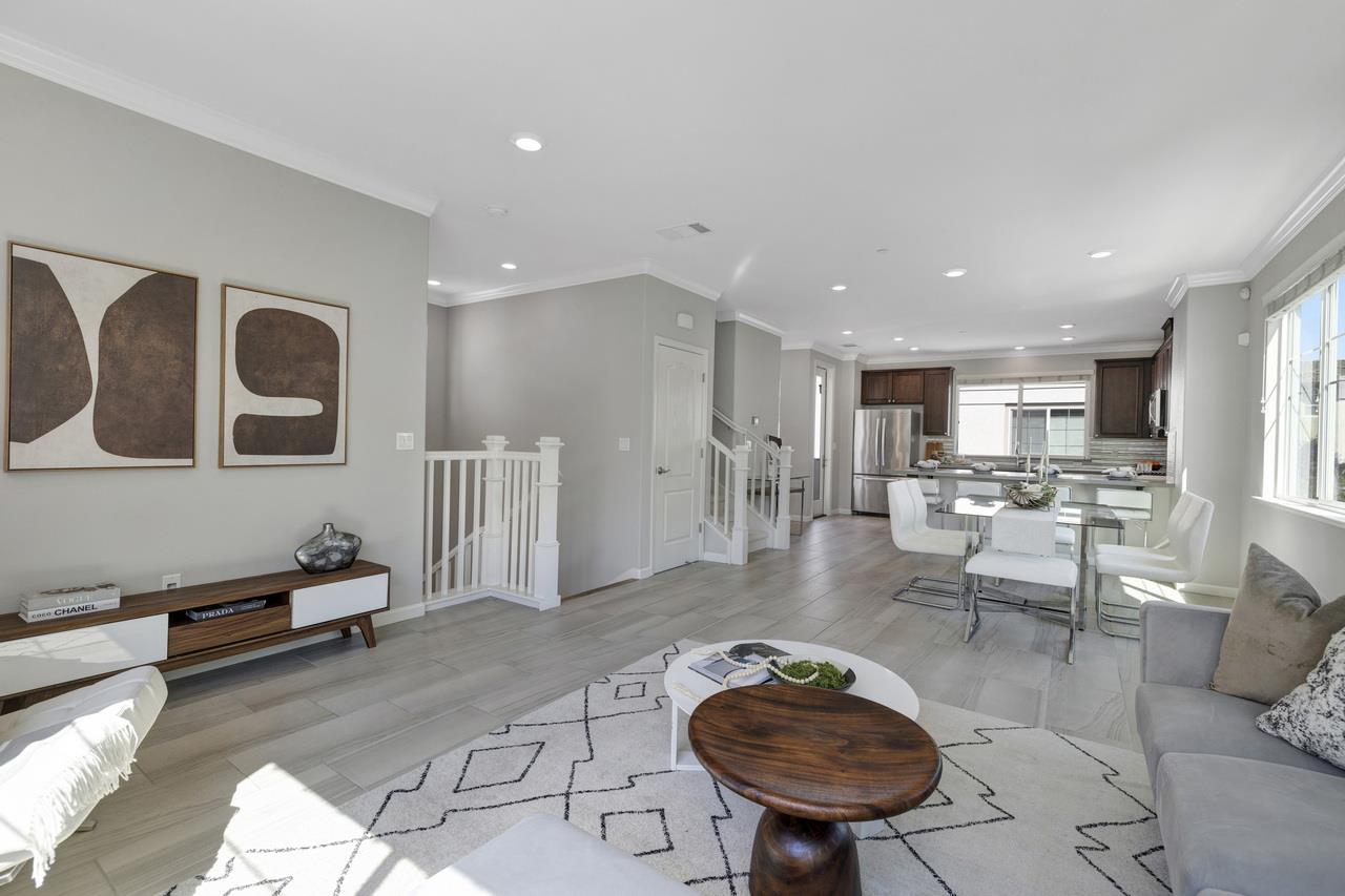 3079 Manuel Loop San Jose, CA 95136 - Photo 9 of 64 a living room with furniture a table and kitchen view