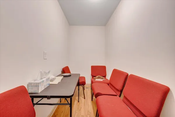 a living room with furniture and a chair