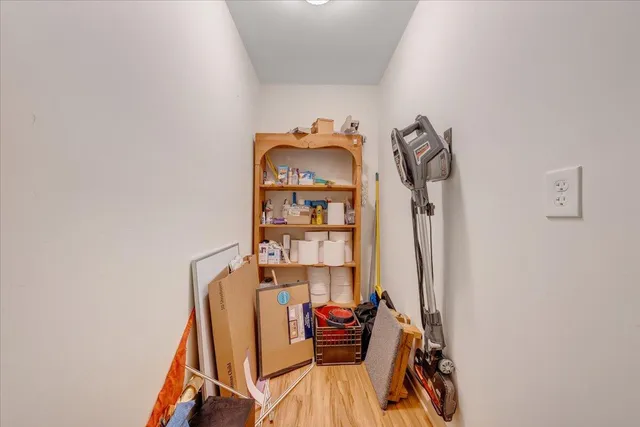 a view of a room with rack and wooden floor