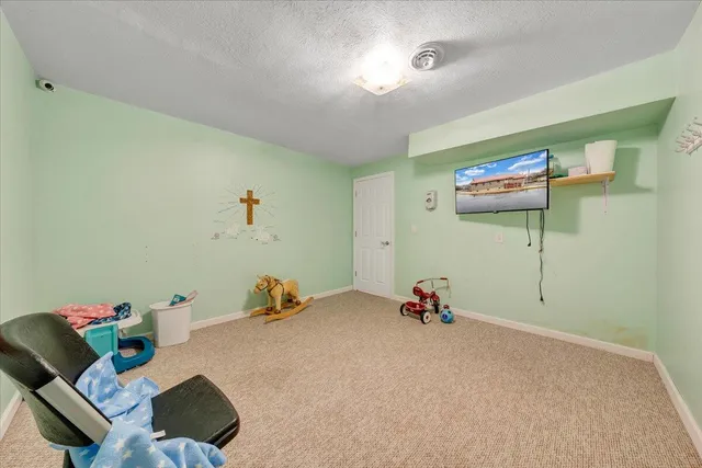 a view of entryway livingroom and hall with wooden floor