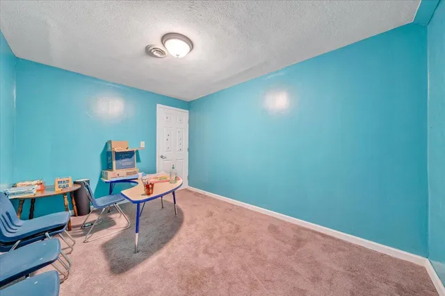 a view of a workspace with furniture