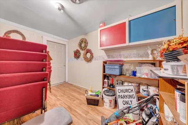a view of an entryway with wooden floor