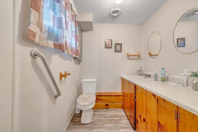a white toilet sitting next to a bathroom sink