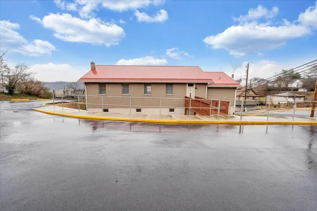 a view of a house with swimming pool
