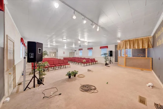 a kitchen with a refrigerator and a sink