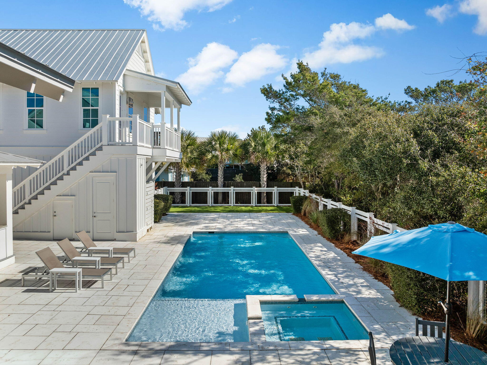 44 Seacrest Drive Inlet Beach, FL 32461 - Photo 15 of 129 a view of a patio with couches table and chairs with wooden floor and fence