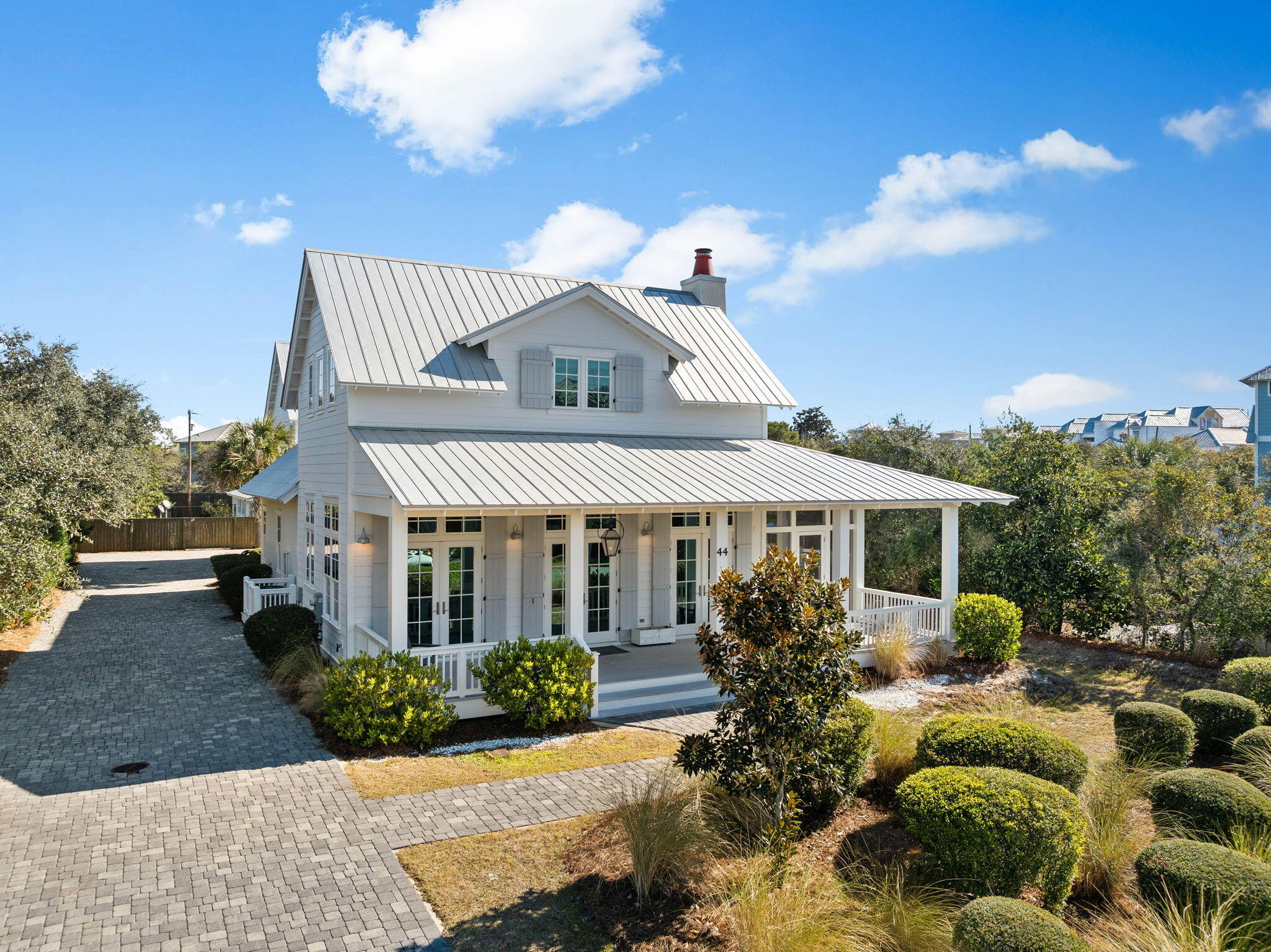 44 Seacrest Drive Inlet Beach, FL 32461 - Photo 2 of 129 a front view of a house with garden
