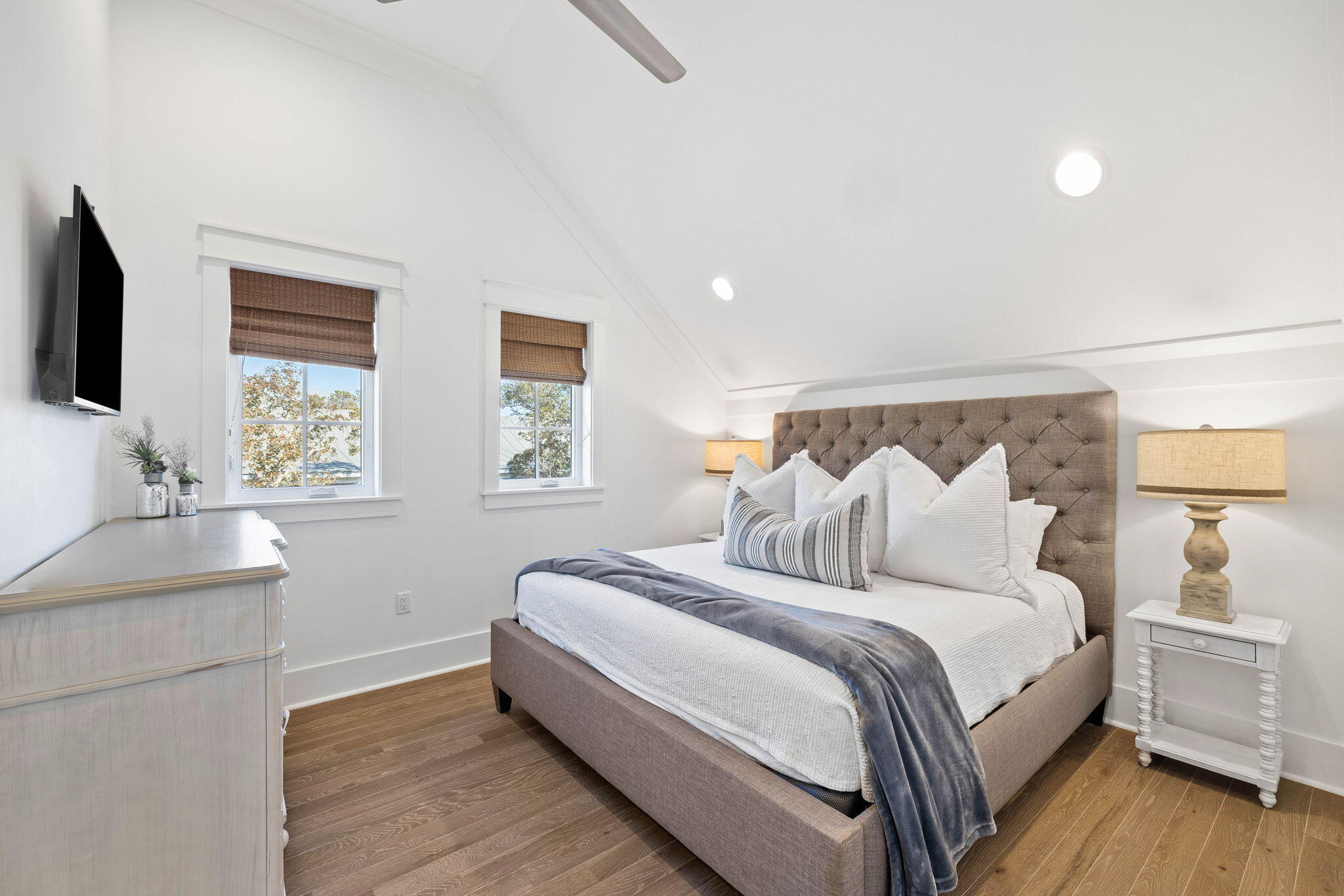 44 Seacrest Drive Inlet Beach, FL 32461 - Photo 61 of 129 a bedroom with bed and a flat tv screen on dresser