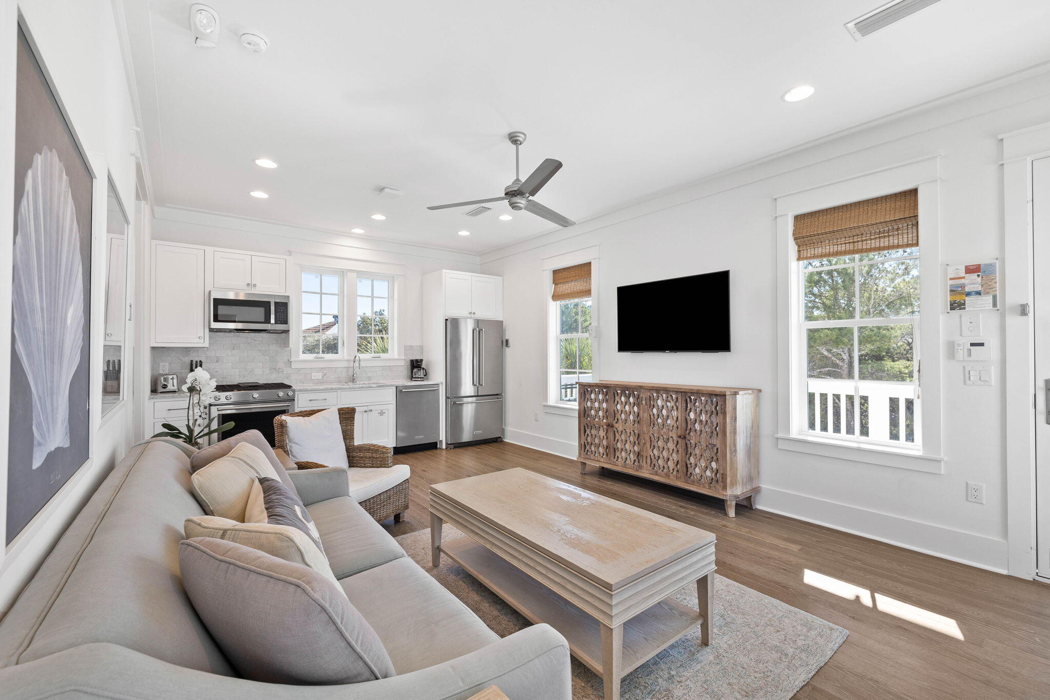 44 Seacrest Drive Inlet Beach, FL 32461 - Photo 77 of 129 a living room with furniture a flat screen tv and kitchen view