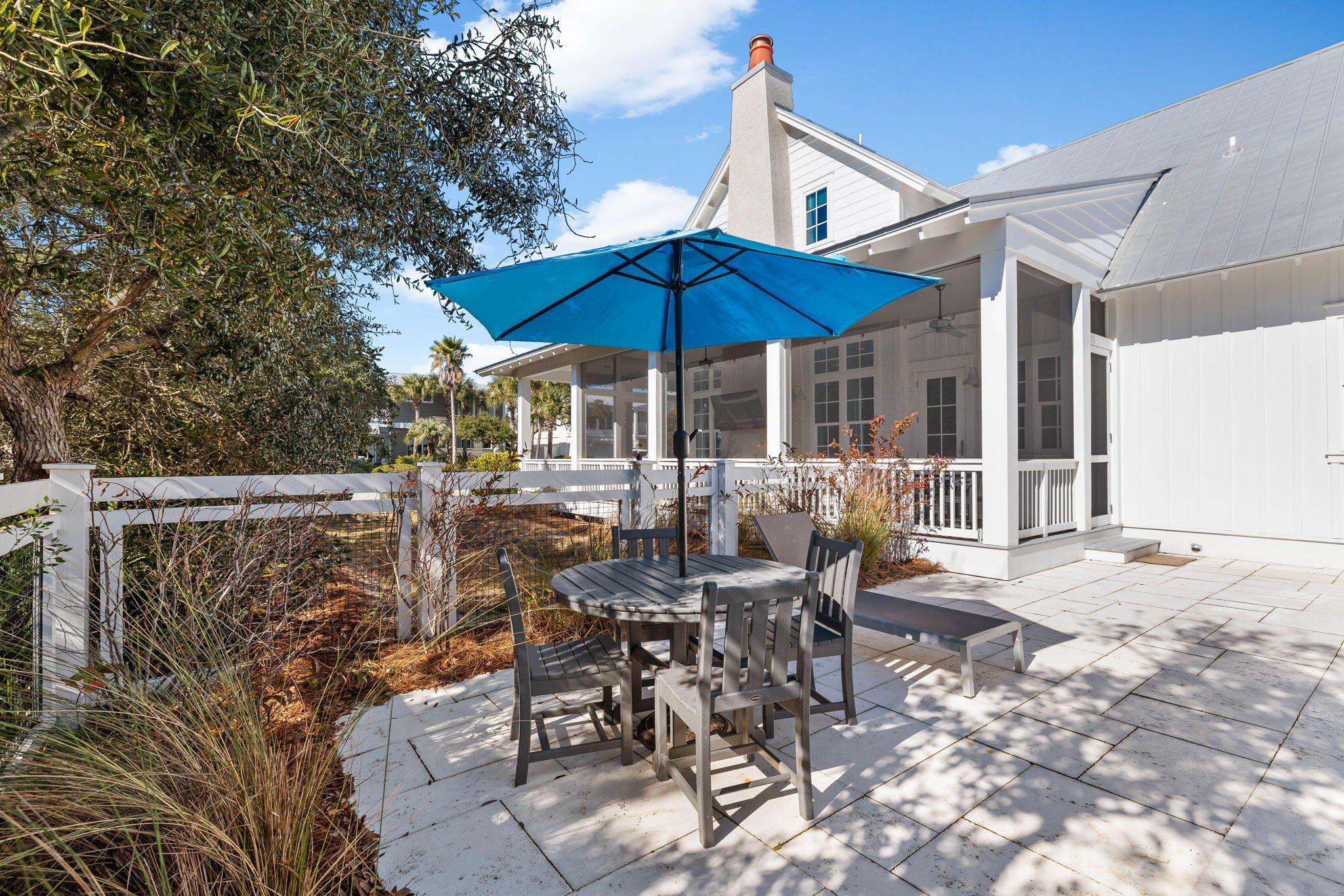 44 Seacrest Drive Inlet Beach, FL 32461 - Photo 91 of 129 a view of a patio with table and chairs under an umbrella