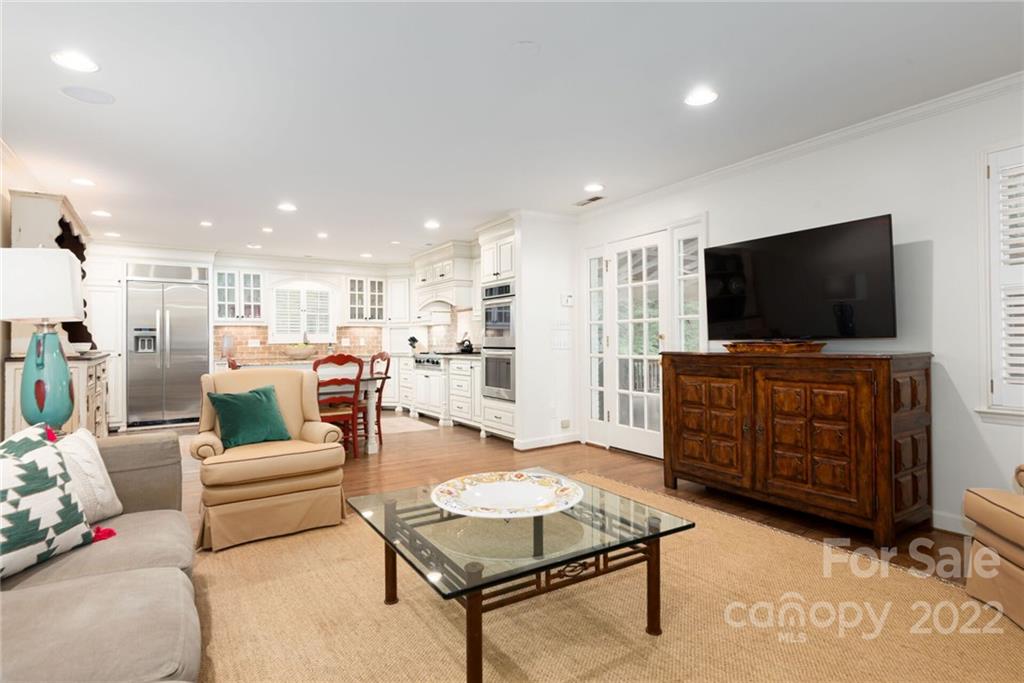 2815 Wickersham Road Charlotte, NC 28211 - Photo 13 of 34 a living room with furniture and a flat screen tv