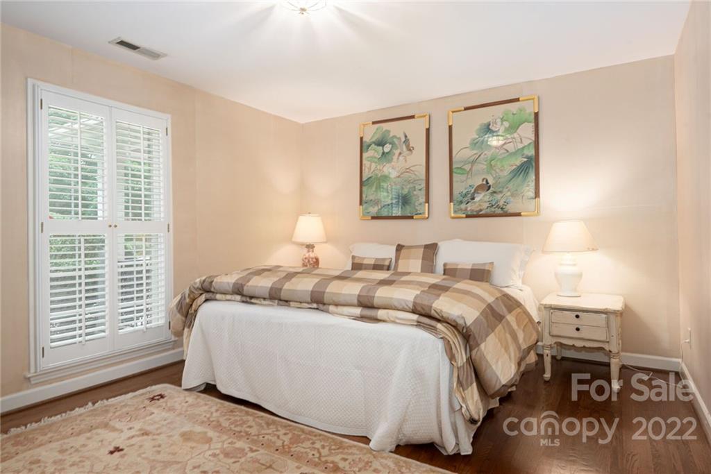2815 Wickersham Road Charlotte, NC 28211 - Photo 15 of 34 a bed room with a bed and a window