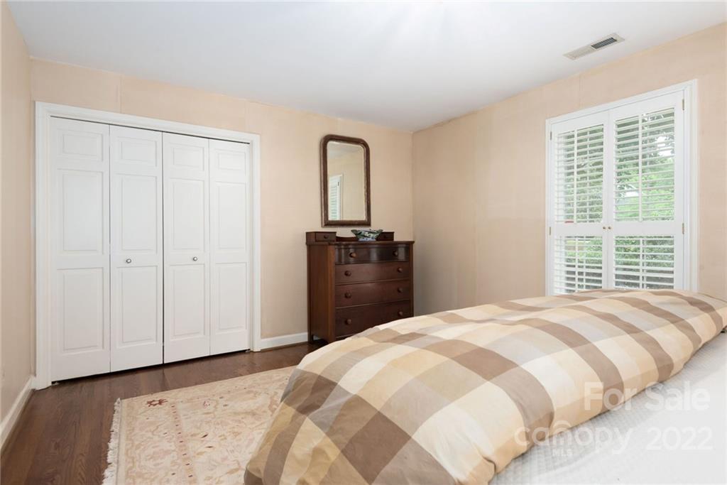2815 Wickersham Road Charlotte, NC 28211 - Photo 16 of 34 a bedroom with a bed and a dresser