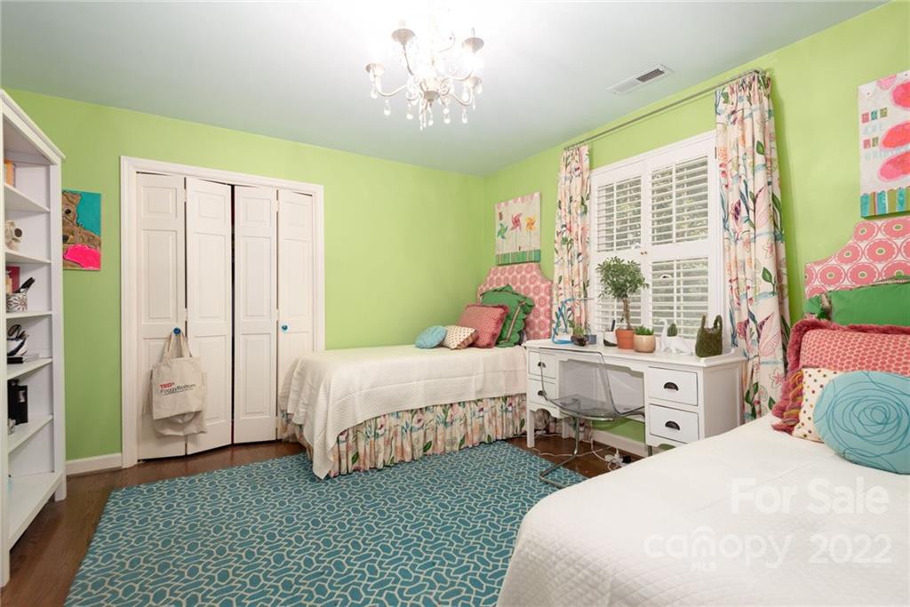 2815 Wickersham Road Charlotte, NC 28211 - Photo 17 of 34 a bedroom with a bed and a window