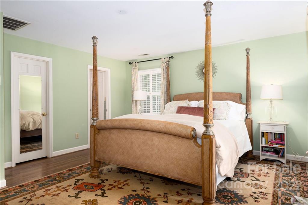 2815 Wickersham Road Charlotte, NC 28211 - Photo 19 of 34 a bedroom with a bed window and walk in closet