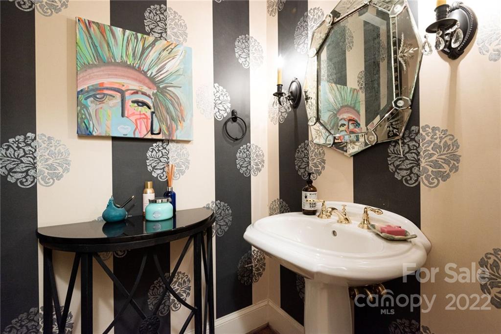 2815 Wickersham Road Charlotte, NC 28211 - Photo 22 of 34 a view of a dining room with furniture and wooden floor