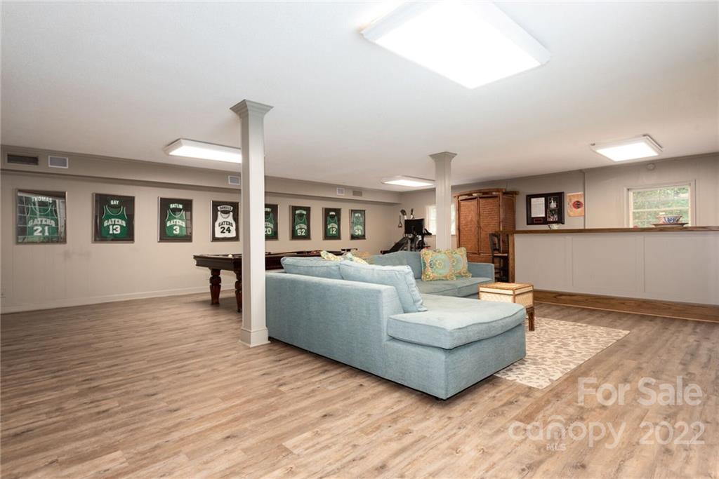 2815 Wickersham Road Charlotte, NC 28211 - Photo 23 of 34 a living room with furniture and a wooden floor