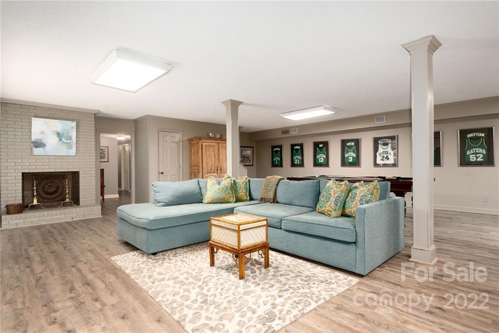 2815 Wickersham Road Charlotte, NC 28211 - Photo 24 of 34 a living room with furniture and a fireplace