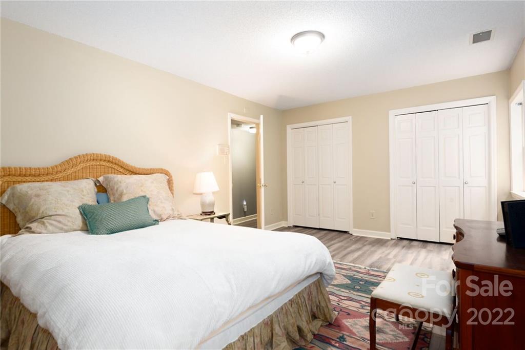 2815 Wickersham Road Charlotte, NC 28211 - Photo 27 of 34 a bedroom with a bed and a table