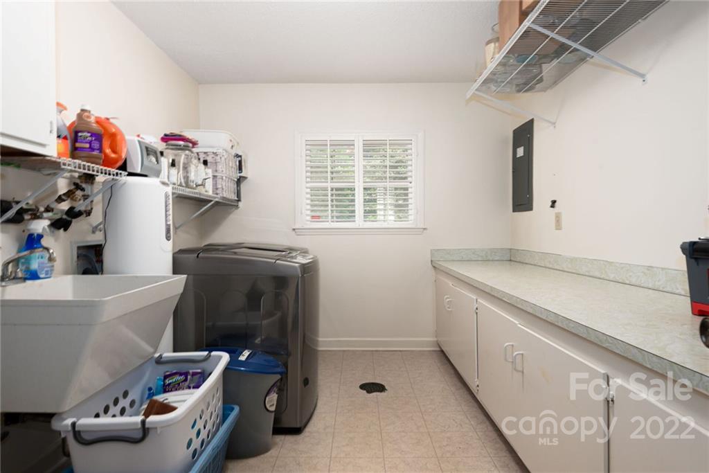 2815 Wickersham Road Charlotte, NC 28211 - Photo 28 of 34 a utility room with fridge dryer and washer