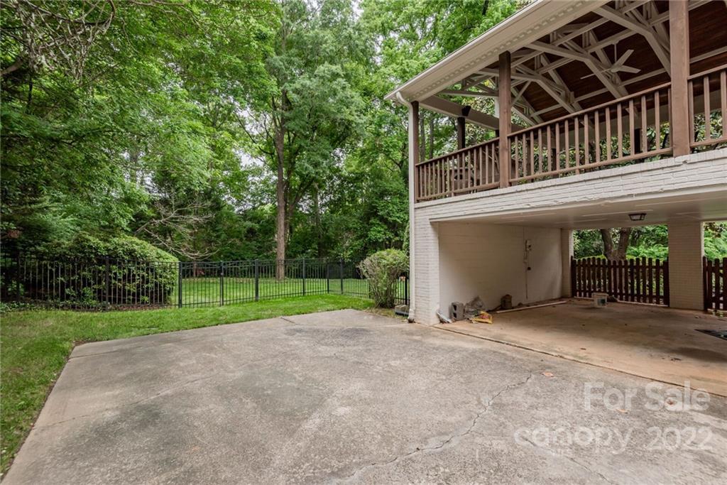 2815 Wickersham Road Charlotte, NC 28211 - Photo 29 of 34 a view of a house with a yard and large trees