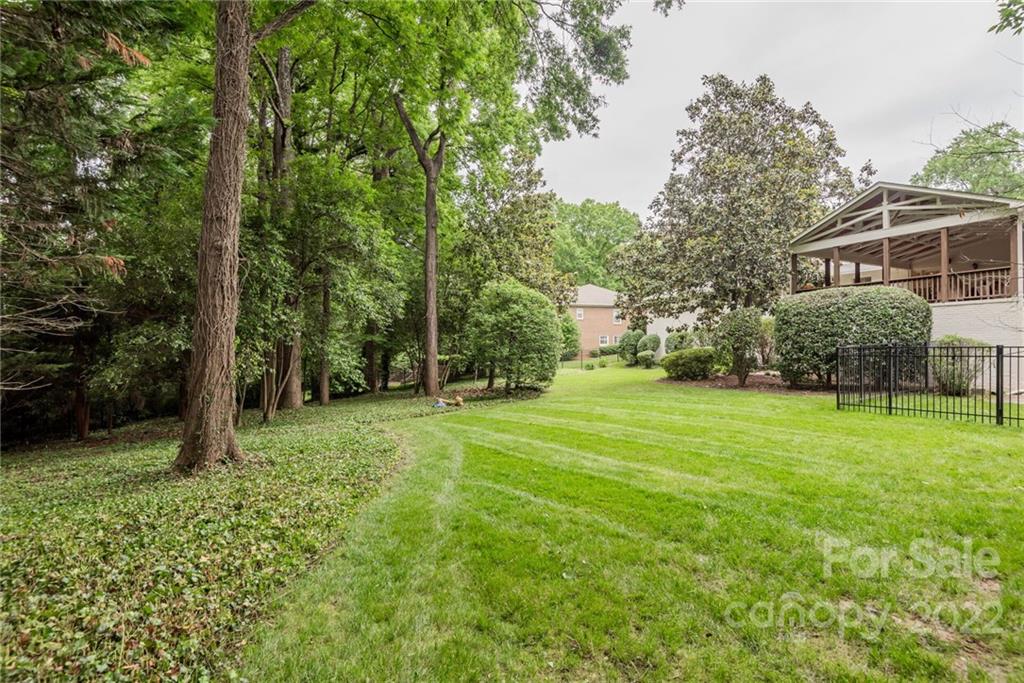 2815 Wickersham Road Charlotte, NC 28211 - Photo 32 of 34 a view of a backyard with large trees