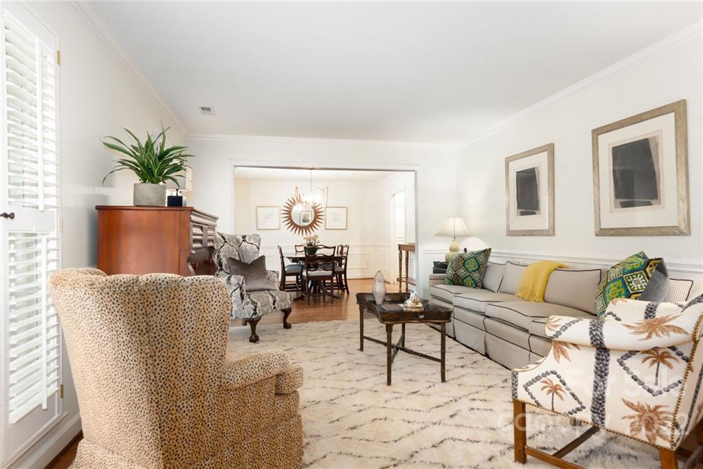 2815 Wickersham Road Charlotte, NC 28211 - Photo 4 of 34 a living room with furniture and a potted plant