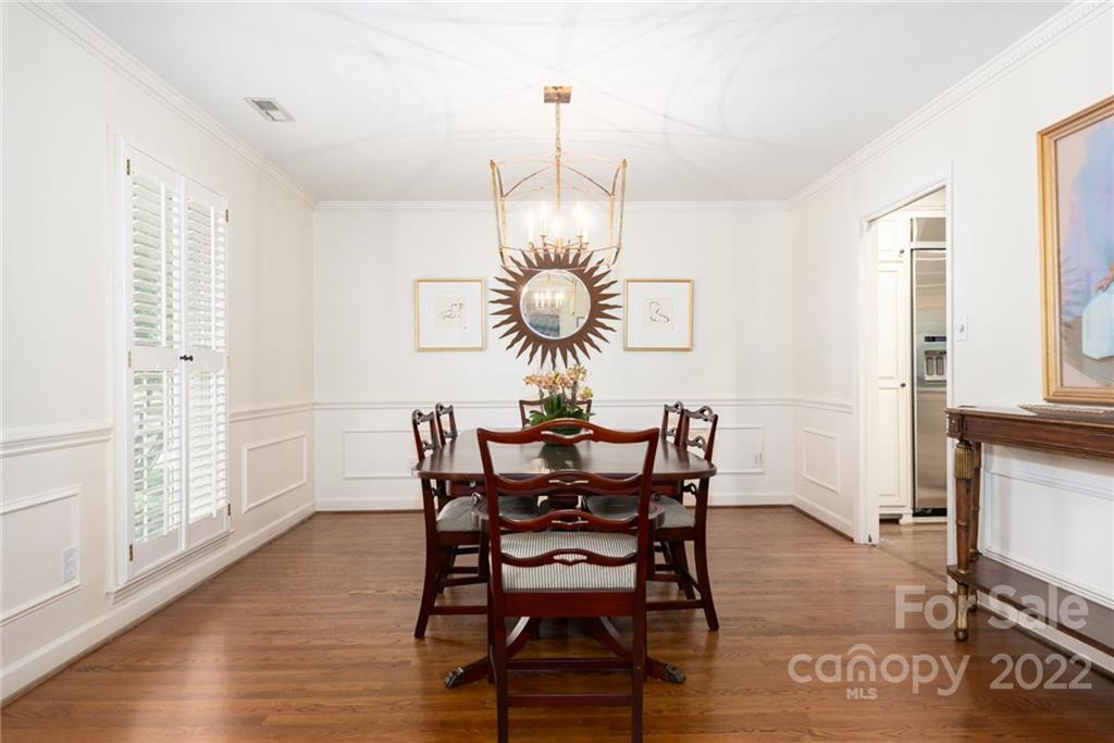 2815 Wickersham Road Charlotte, NC 28211 - Photo 6 of 34 a view of a dining room with furniture window and wooden floor