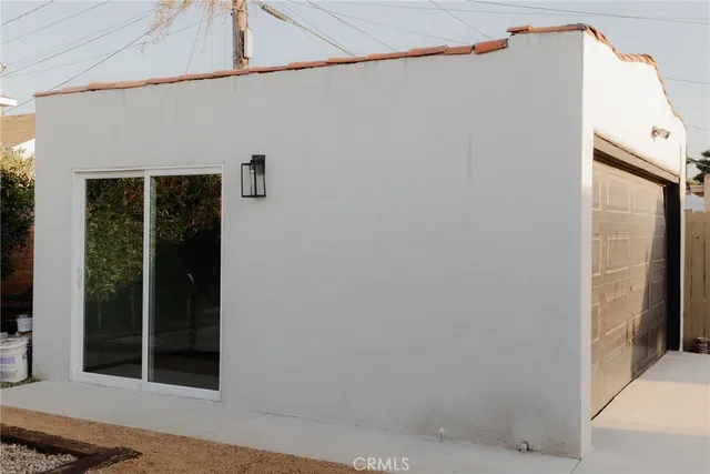 a view of living room with furniture and floor to ceiling window