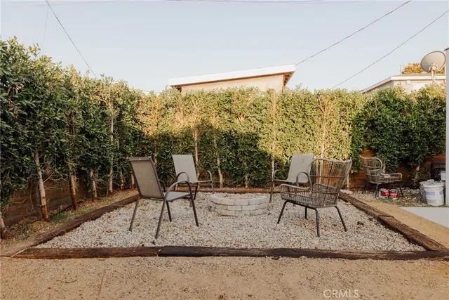 a view of porch with furniture and a backyard