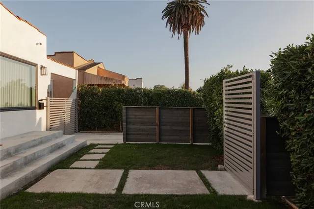 a kitchen with a refrigerator and a sink