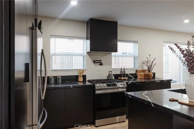 a view of a livingroom with furniture and a hallway