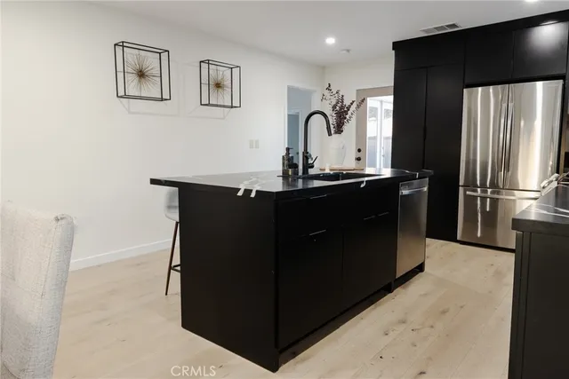 a bedroom with a bed and a chair