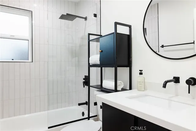 a view of a hallway with bedroom and bathroom