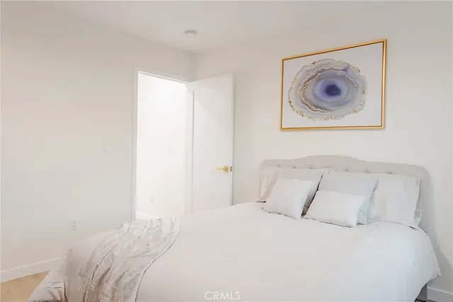 a view of a patio with table and chairs with wooden floor and fence