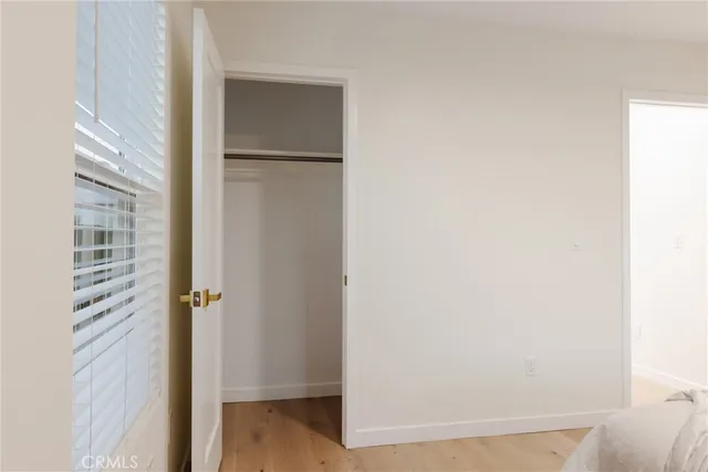 a view of a patio with table and chairs with wooden floor and fence