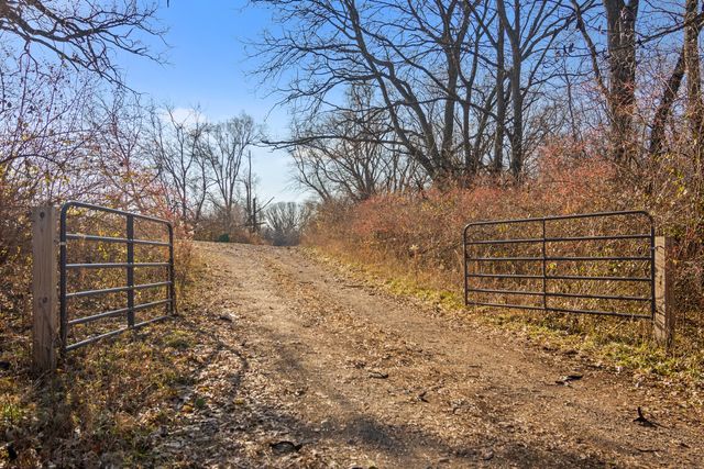 a view of wooden fence and trees