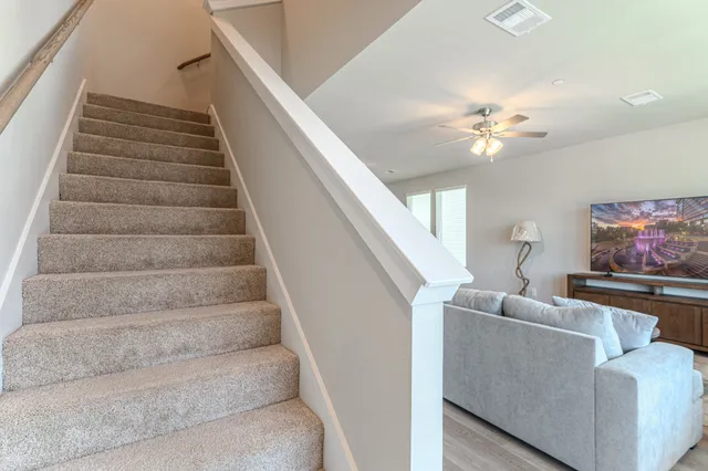 a view of entryway and hall with wooden floor