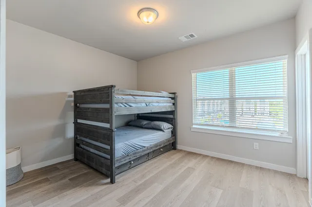 a room with a bed and a window