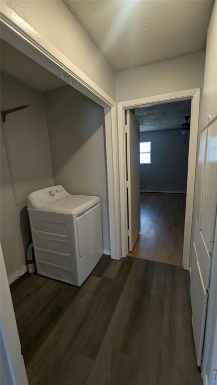 107 Beck Street, Unit B Florence, TX 76527 - Photo 5 of 8 Functional laundry space with a modern washer and dryer set, adjacent to a living area.