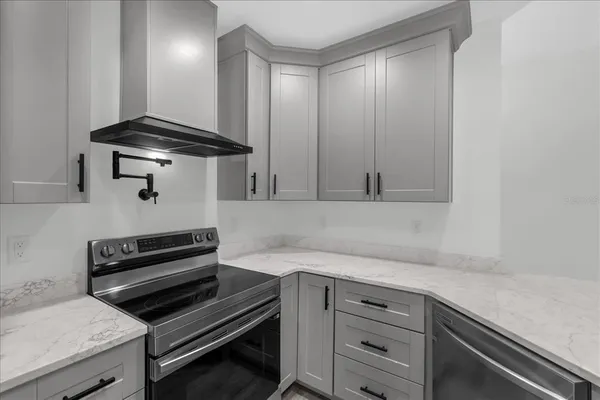 a kitchen with a stove and a microwave