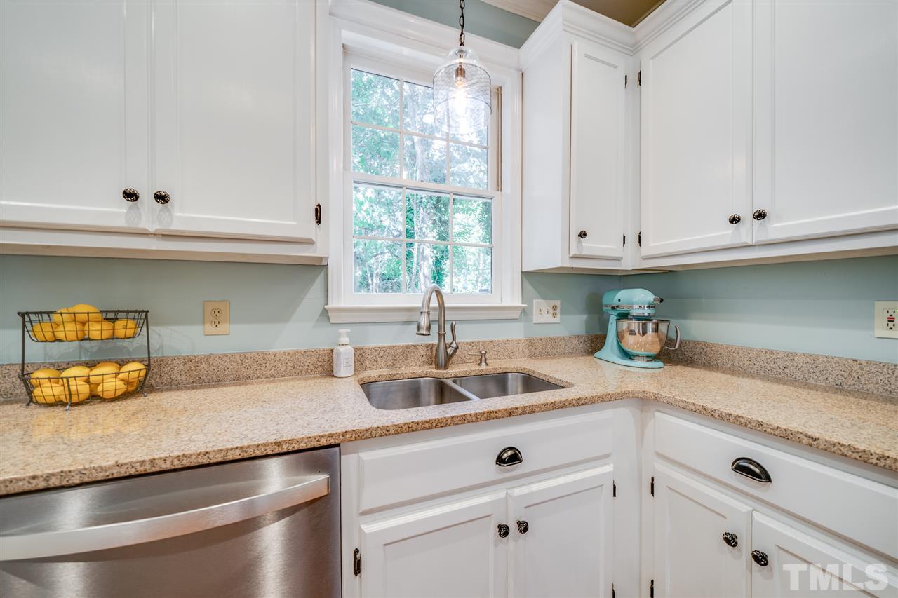 2101 Fountain Ridge Road Chapel Hill, NC 27517 - Photo 8 of 30 a kitchen with granite countertop a sink and cabinets