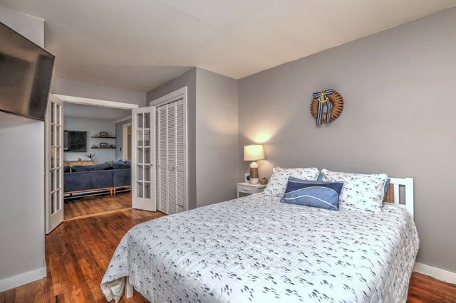 a view of a living room with a large window